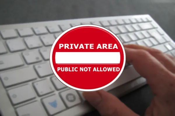 Keyboard with stop sign and 'Private Area-Public Not Allowed' text symbolizing privacy boundaries for 'XXX' content.