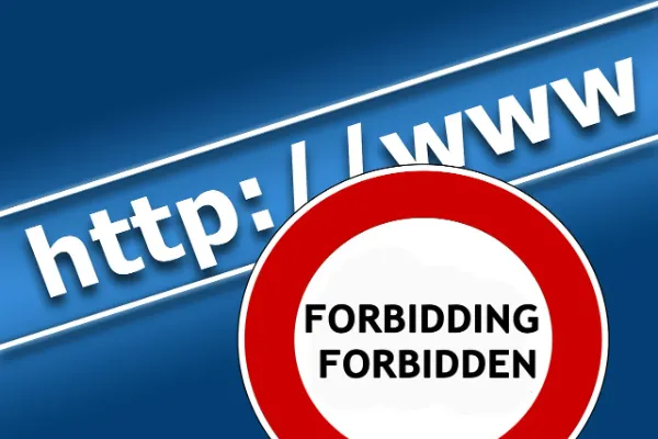 Blue stop sign with 'forbidding' and 'forbidden' text representing the taboo nature of 'XXX' content on websites.